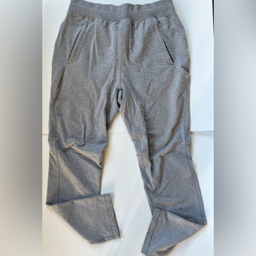 A. Lululemon men's light grey sweatpants w/ drawstring waist & pockets